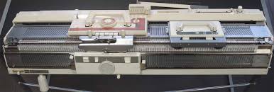 Brother punchcard knitting machine with ribber and lace carriage.